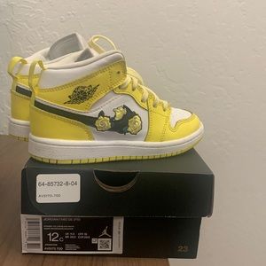 Yellow Jordan 1 with flowers on the swoosh